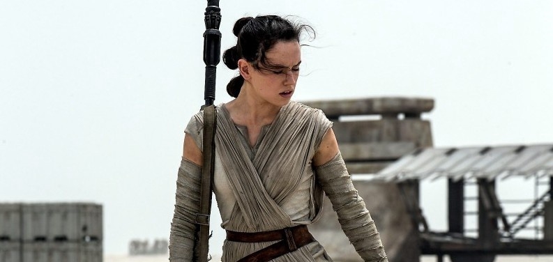 This photo provided by Disney/Lucasfilm shows Daisy Ridley as Rey in a scene from the film, ”Star Wars: The Force Awakens,” directed by J.J. Abrams. The movie opens in U.S. theaters on Dec. 18, 2015. (David James/Disney/Lucasfilm via AP)