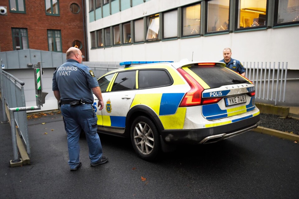 The 20-year-old arrives at Kristianstad District Court with a police officer prior to the detention hearing.