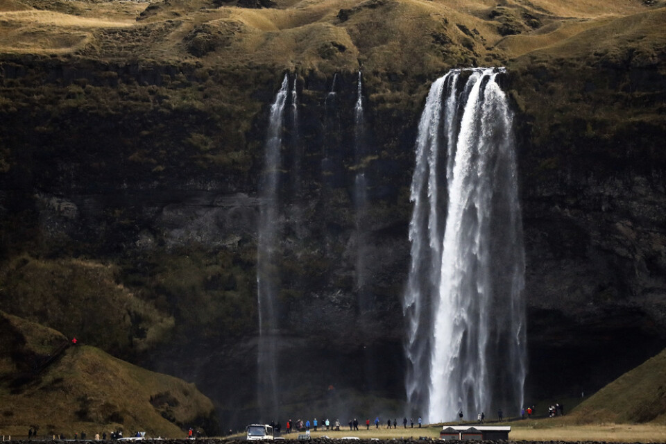 Island, känd för sina vulkaner, glaciärer och orörda natur, drar in en stor del av sina intäkter från turism. Arkivbild