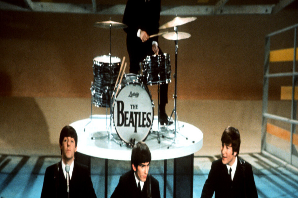 The Beatles på The Sullivan Show i USA 1964. Arkivbild.
