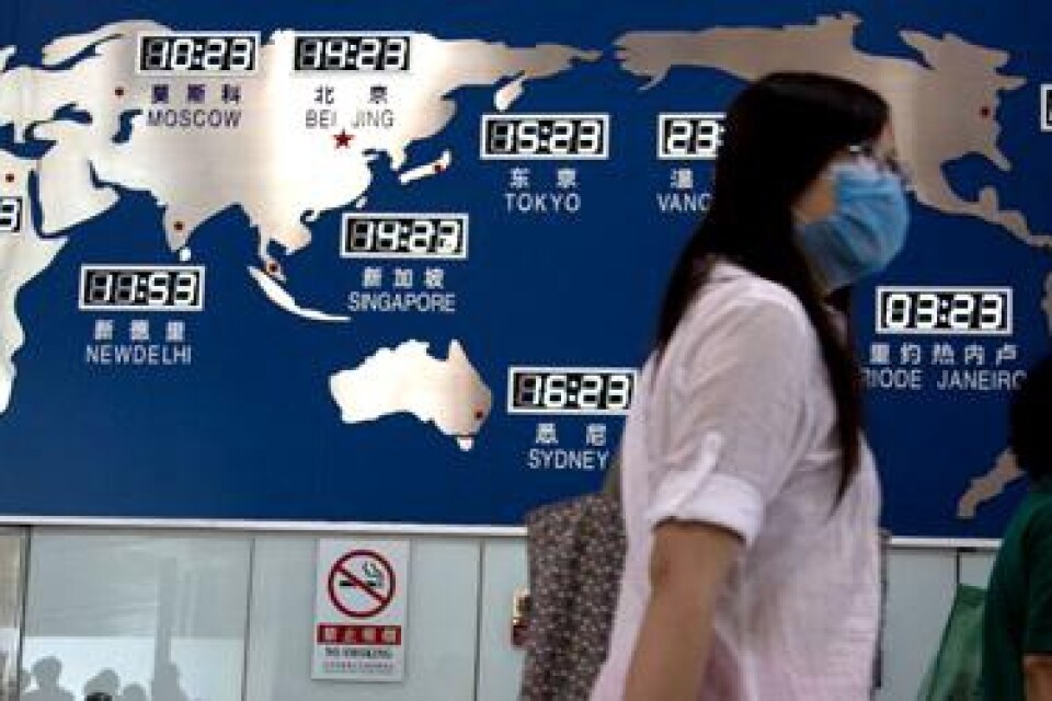 Kinesiska kvinnor som har ansiktsmasker som skydd, i slutet av maj. Bild: Scanpix