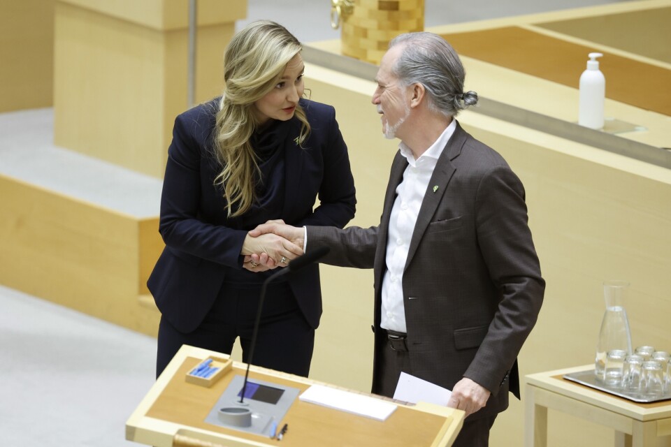 Kristdemokraternas partiledare Ebba Busch och Miljöpartiets språkrör Daniel Helldén under partiledardebatten i riksdagen nyligen.