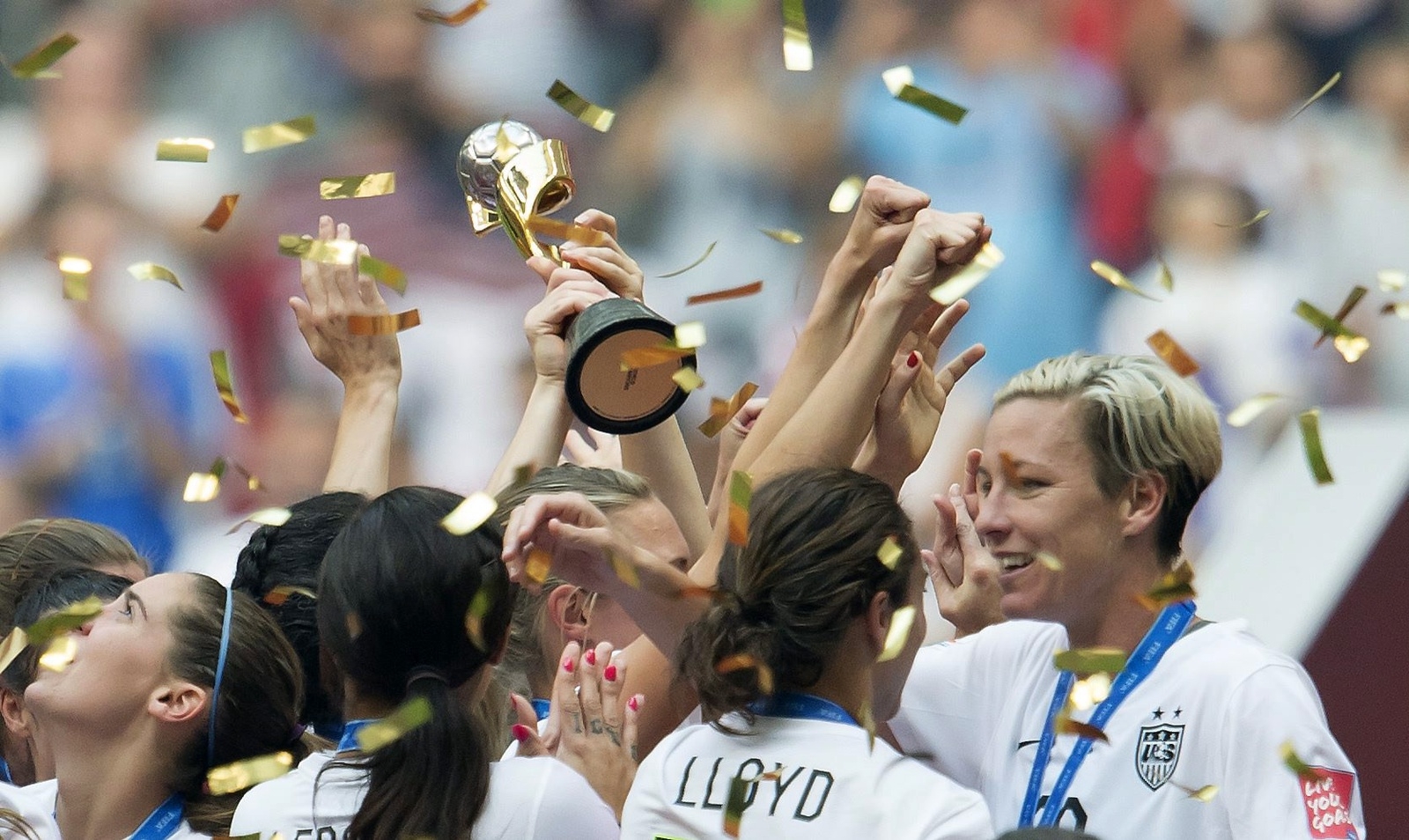 United States' Carli Lloyd and Abby Wambach, right, embrace as the team celebrates their win over Japan following the second half of the FIFA Women's World Cup soccer championship in Vancouver, British Columbia, Canada, Sunday, July 5, 2015.   (Jonathan Hayward/The Canadian Press via AP) MANDATORY CREDIT