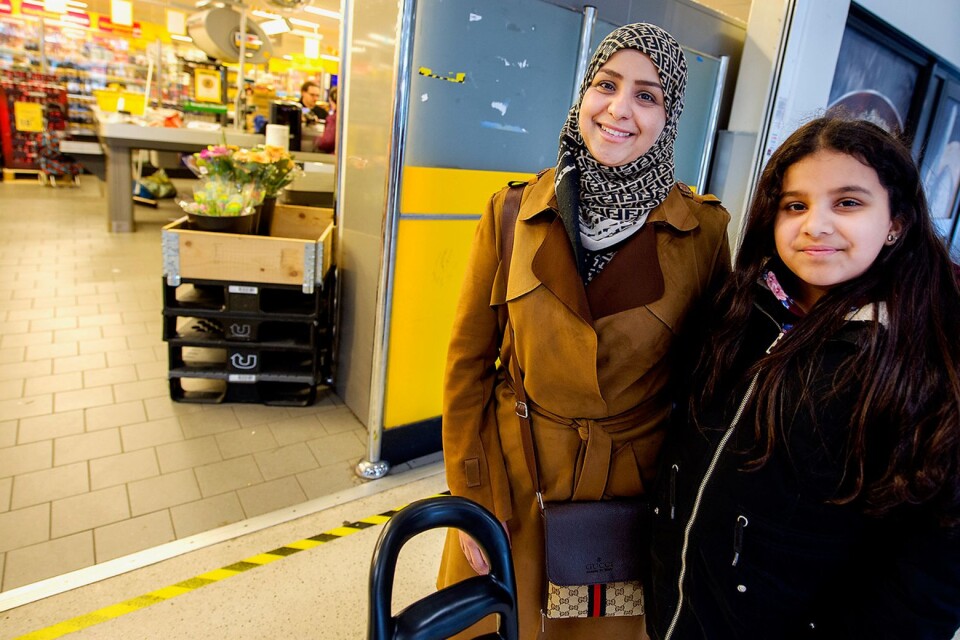 ”I’m shopping like it’s a regular Friday, says Nawal Hlail, with Hiba, her daughter.