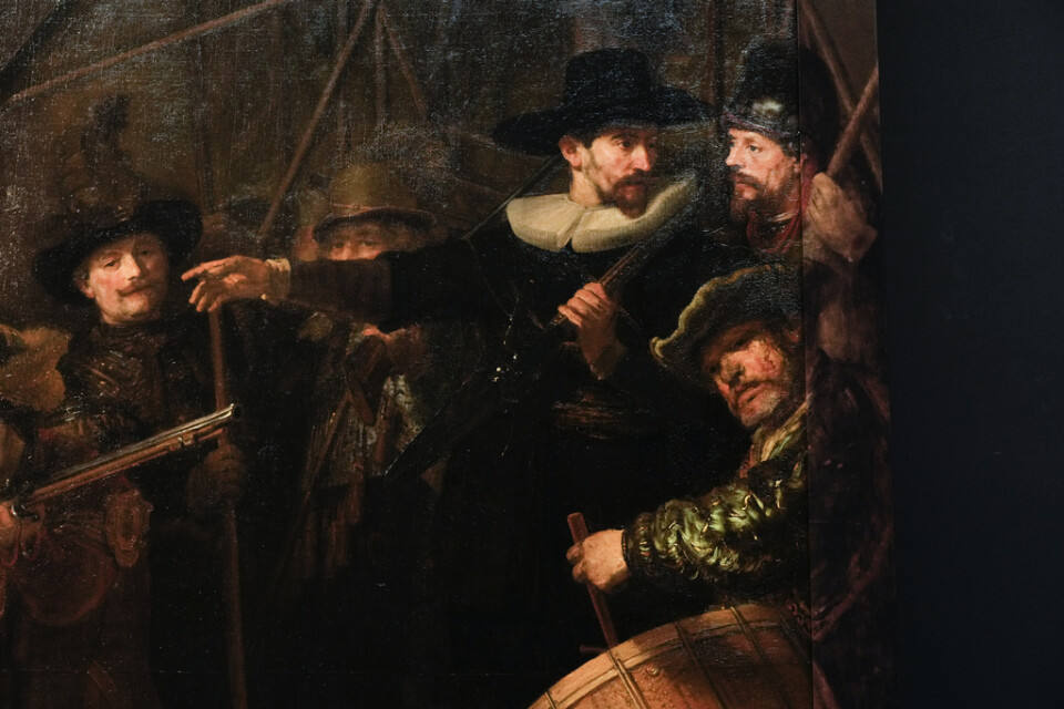 Utsnitt ur Rembrandts berömda målning "Nattvakten". Arkivbild