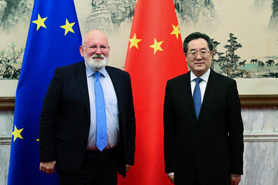 EU:s klimatkommissionär Frans Timmermans och Kinas vice premiärminister Ding Xuexiang i Peking.