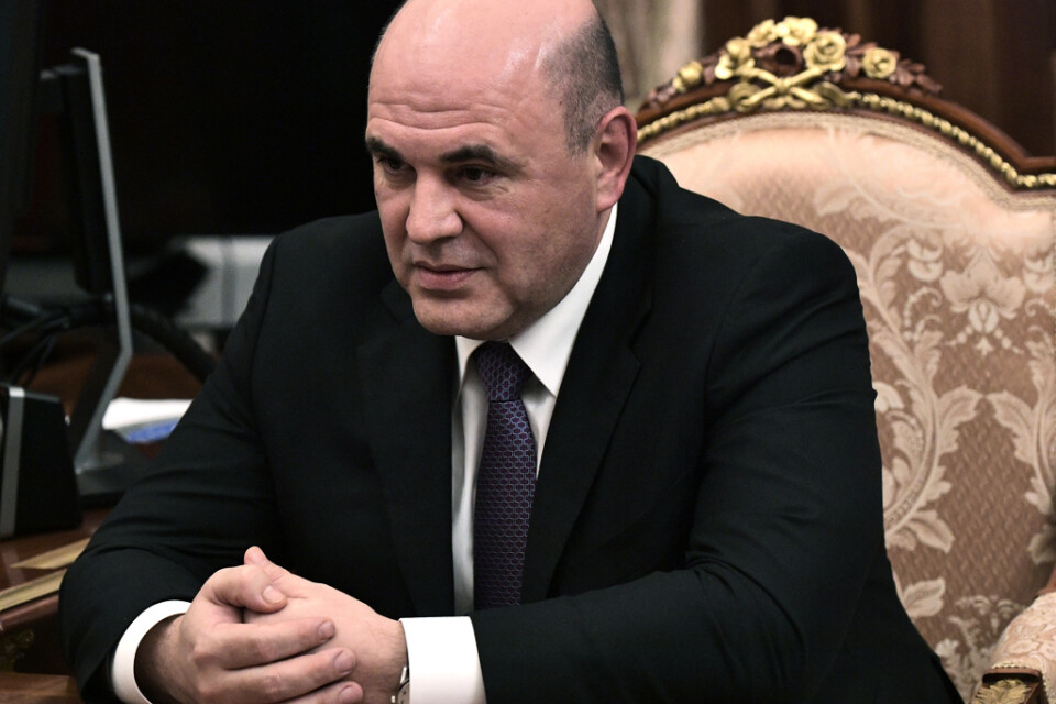 Michail Misjustin har godkänts som Rysslands nya premiärminister av statsduman. Bilden är tagen under ett möte med president Vladimir Putin på onsdagen.