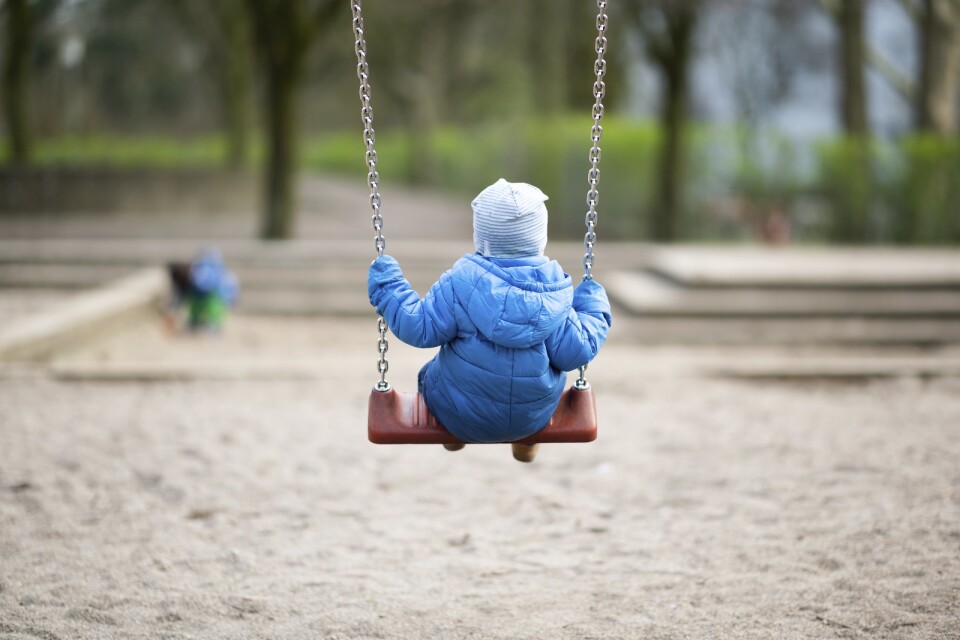 A toddler rocking on a playground in Hamburg, Germany, Tuesday, March 17, 2020. Due to the corona virus, daycare centers are closed in most federal states since this Monday. The question of childcare is a major challenge for millions of parents. Only for most people, the new coronavirus causes only mild or moderate symptoms, such as fever and cough. For some, especially older adults and people with existing health problems, it can cause more severe illness, including pneumonia. (Daniel Reinhardt/dpa via AP)