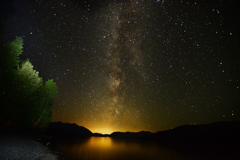 The Milky Way lights up the sky just after 3 a.m. on Thursday, July 18, 2013 over Lake McDondald in Glacier National Park, Mont. (AP/Daily Inter Lake, Brenda Ahearn)