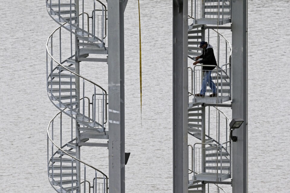 A worker navigates a circular stairway while doing maintenance at the B. Everett Jordan Dam at Jordan Lake in Moncure, N.C., Tuesday, Feb. 2, 2016. (AP Photo/Gerry Broome)