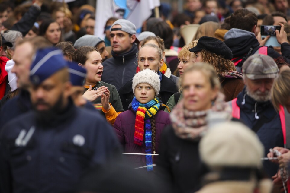Swedish climate activist Greta Thunberg, centre, marches with others during a climate change protest in Brussels, Friday, March 6, 2020. (AP Photo/Olivier Matthys)  FS104