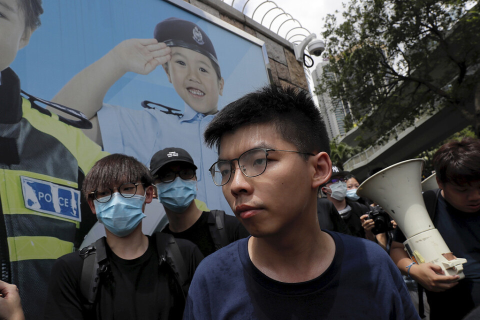 Protestledaren Joshua Wong uppges ha gripits i Hongkong. Bild tagen i juni.