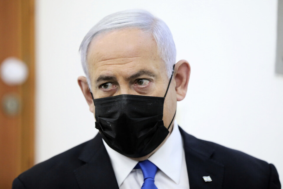 Israels premiärminister Benjamin Netanyahu i en inledande rättegångsprocedur.
