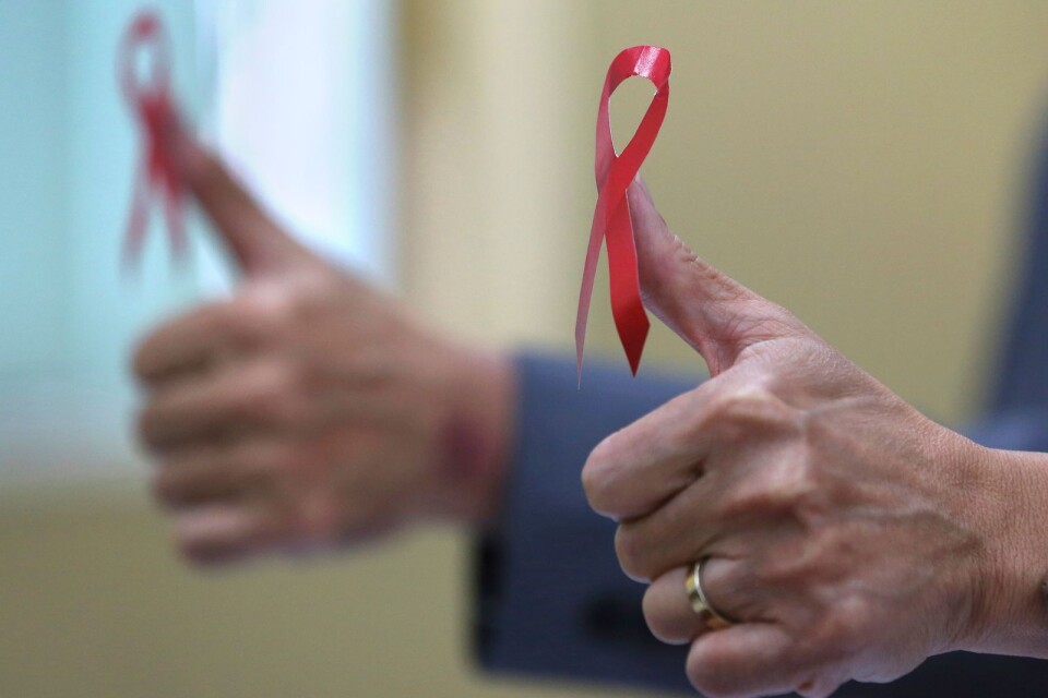 Det röda bandet, symbolen stöd till dem som levet med hiv.