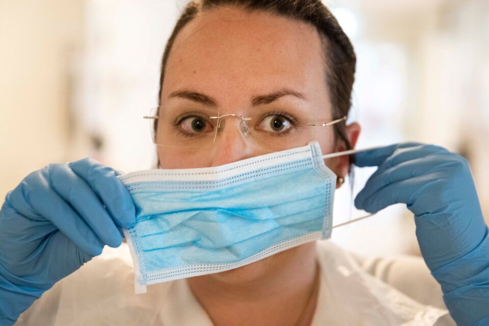 Face masks required. All healthcare personnel should wear face masks when treating a patient closer than one metre to them. Stock image.