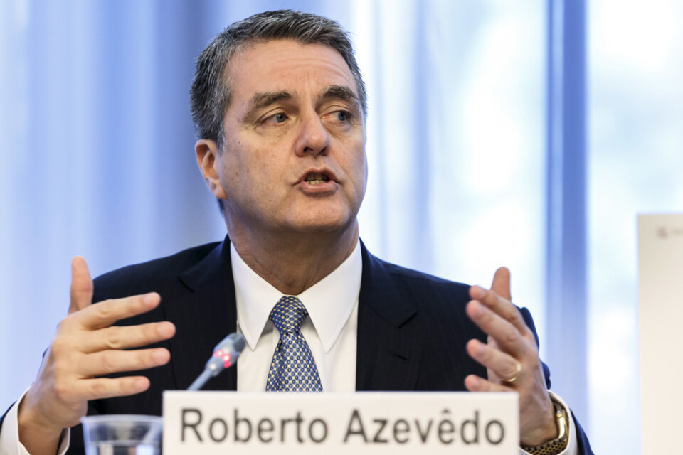 WTO-chefen Roberto Azevédos ekonomer sänker prognosen för global handelstillväxt 2019 och 2020. Arkivbild