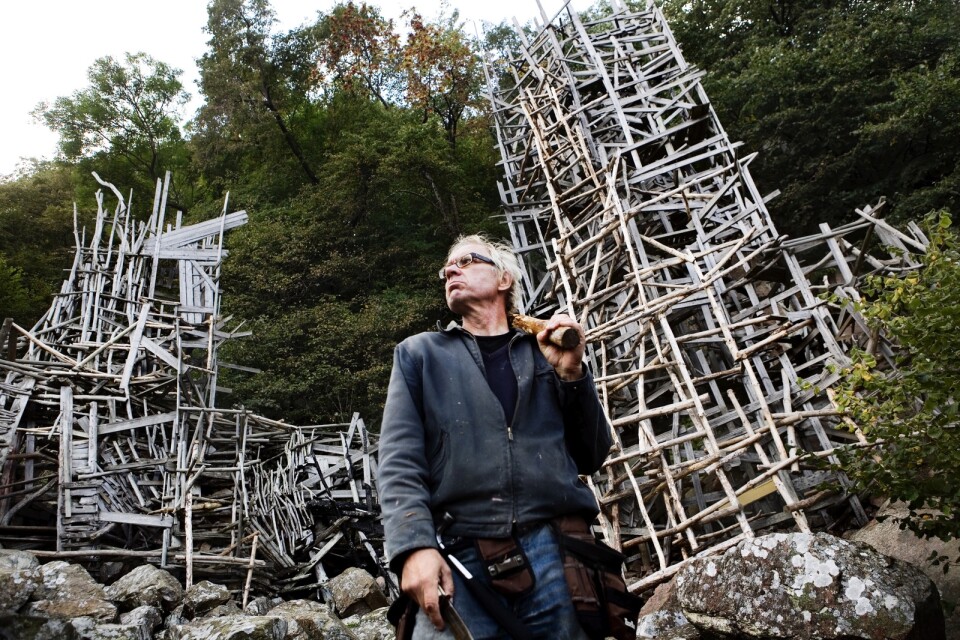 Lars Vilks (1946-2021). Seen here with his artwork ”Nimis” (from 1980), in Kullabergs countryside nationalpark.