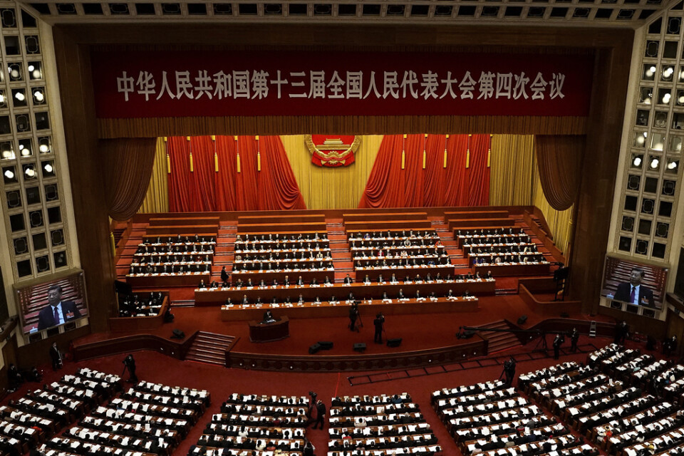 President Xi Jinping syntes på skärmar vid fjolårets nationella folkkongress i Peking. Arkivbild.