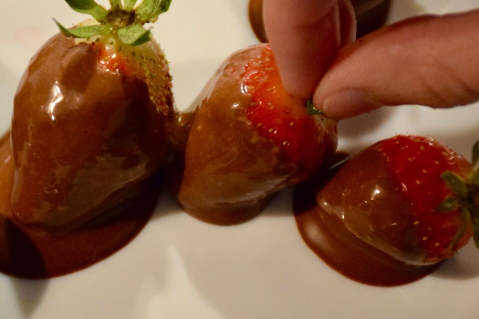 Dip the strawberries in melted chocolate.