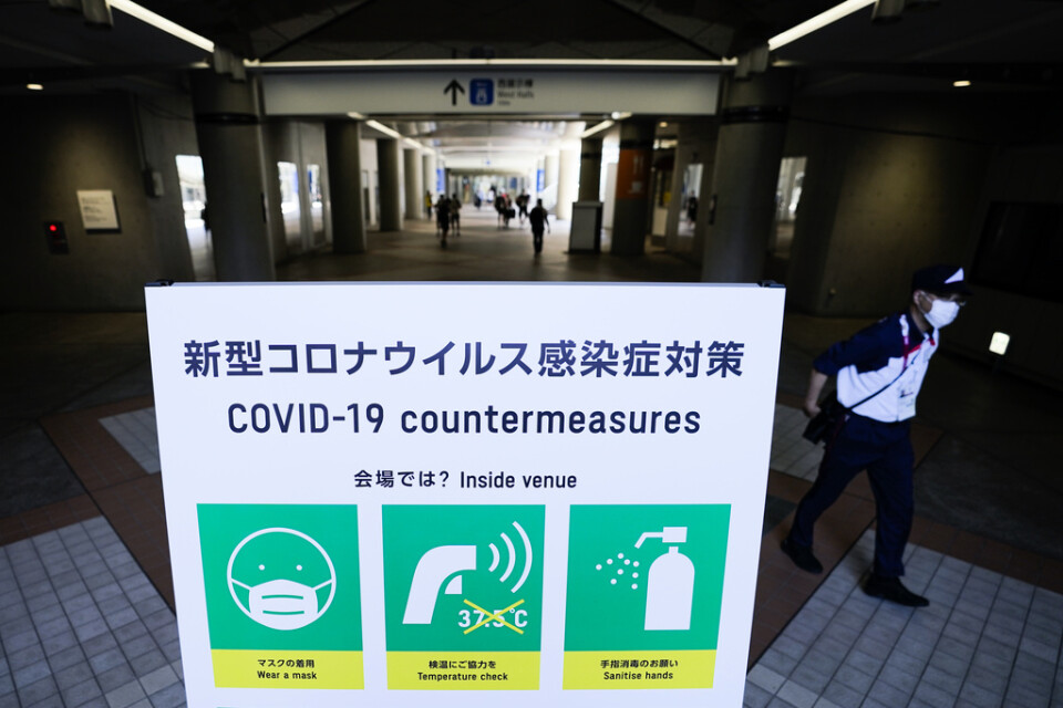 I presscentret i Tokyo uppmanas OS-journalister och -fotografer att bära munskydd och tvätta händerna.