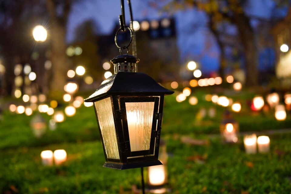 Lanterns are lit on graves in cemeteries at the All Saints’ festival.