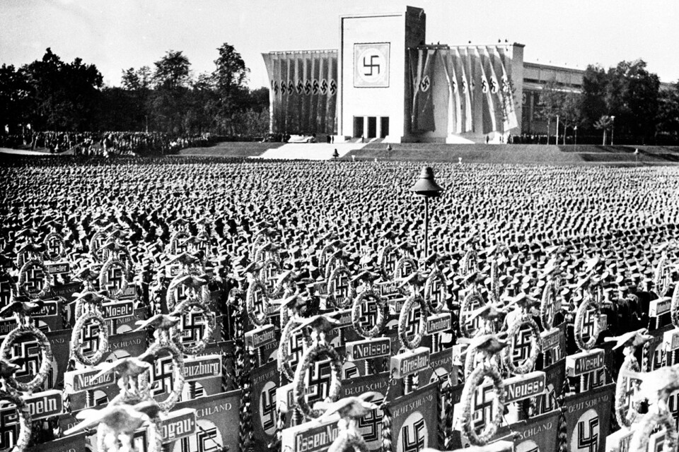 Nuremberg, Germany, Sept. 20, 1936.  The soldiers listened to a speech given by their leader Adolf Hitler.  (AP Photo)