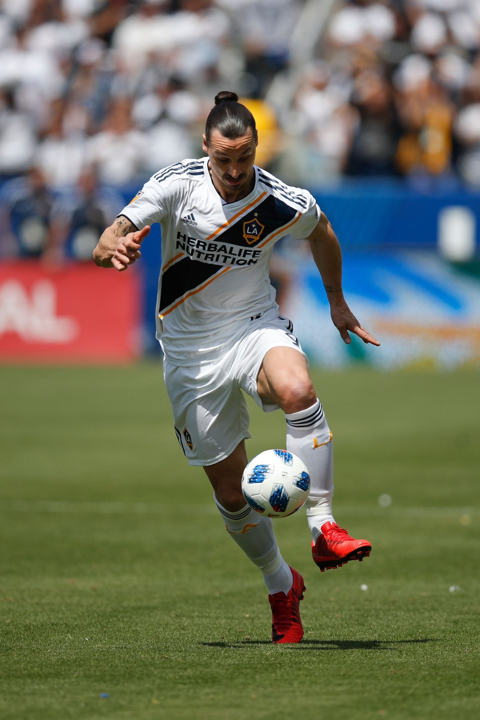 Los Angeles Galaxy's Zlatan Ibrahimovic, of Sweden, controls the ball during the second half of an MLS soccer match against the Los Angeles FC Saturday, March 31, 2018, in Carson, Calif. The Galaxy won 4-3. (AP Photo/Jae C. Hong)