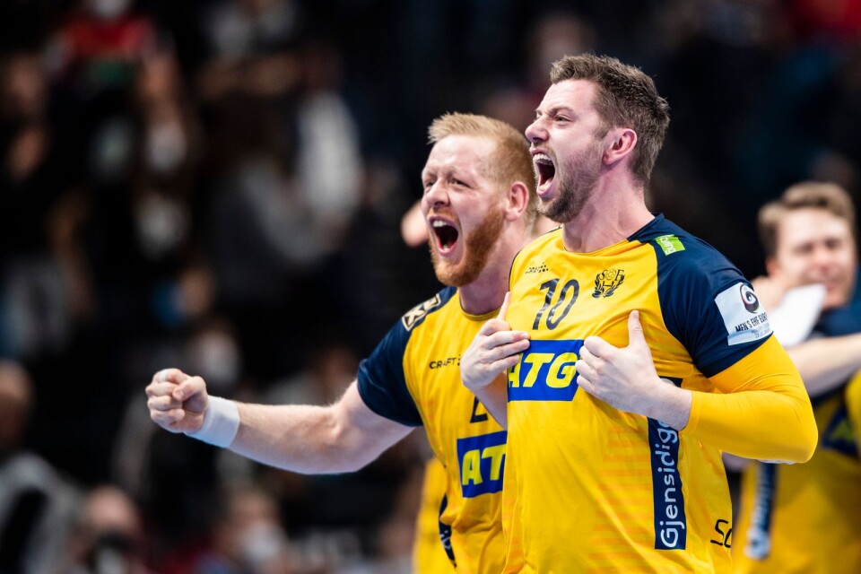 Jim Gottfridsson and Niclas Ekberg of Sweden celebrate after the EHF European Handball Championship final between Sweden and Spain on January 30, 2022 in Budapest.