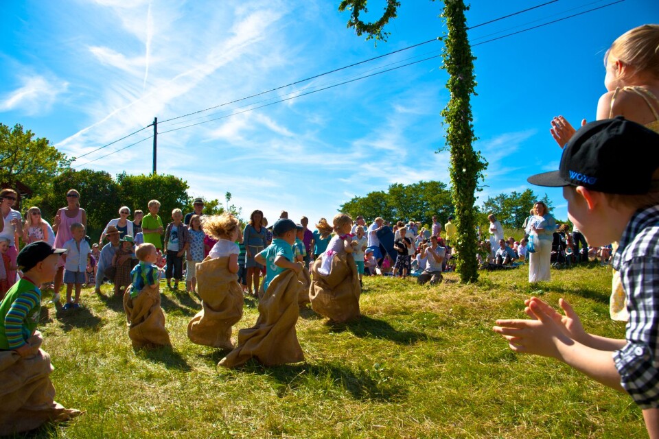 The sack race is a regular game at Midsummer. And so is dancing around the Midsummer pole.