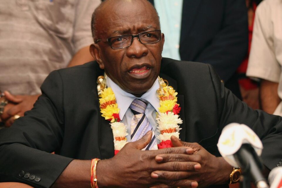 Jack Warner, den förre vice ordföranden i Fifa som är en av de 14 misstänkta i en korruptionshärva, har förts med ambulans till sjukhus från fängelset i Trinidad och Tobago. Warner, som uppger att han drabbats av utmattning, överlämnade sig själv till p