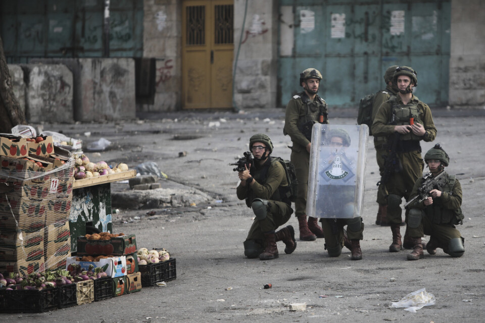 Israeliska soldater under oroligheter i Hebron den 30 januari. Arkivbild.