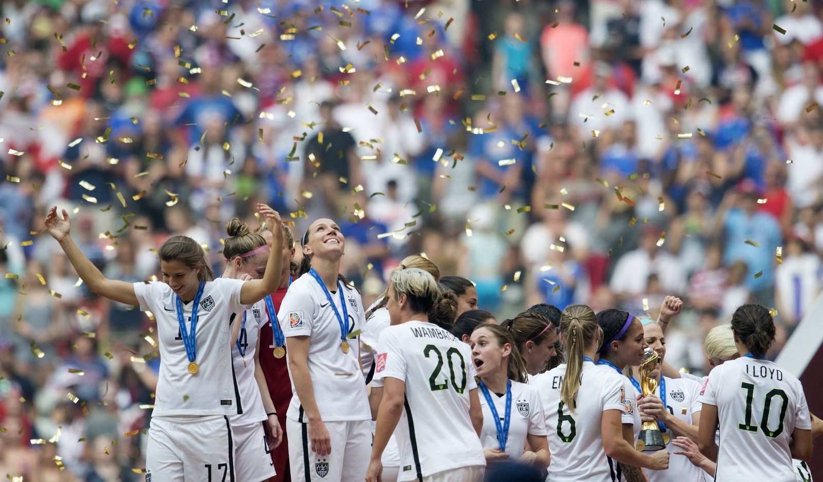 Members of the United States' celebrate their win over Japan at the FIFA Women's World Cup soccer championship in Vancouver, British Columbia, Canada, Sunday, July 5, 2015.   (Jonathan Hayward/The Canadian Press via AP) MANDATORY CREDIT