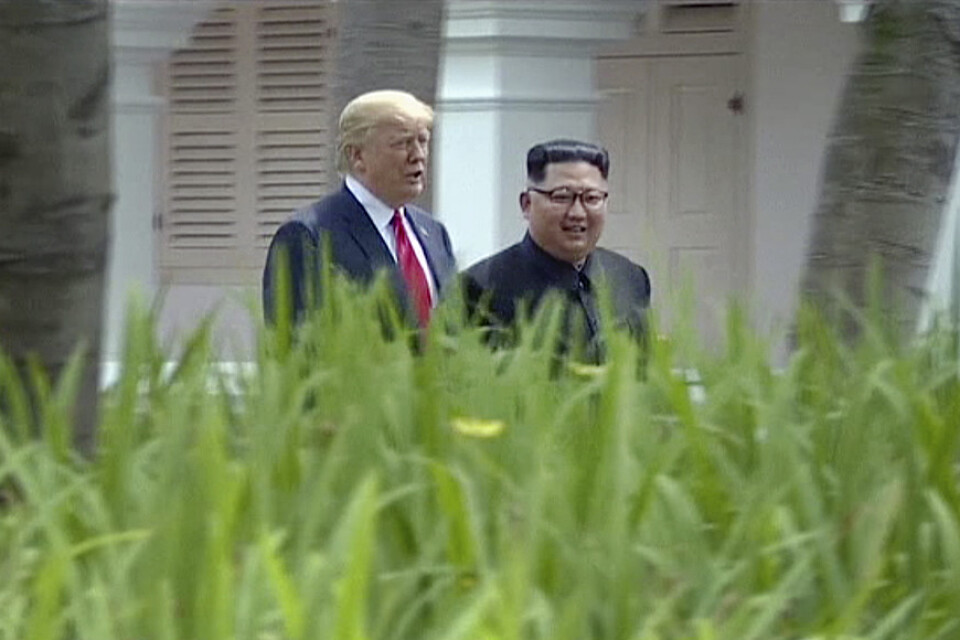 Donald Trump och Kim Jong-Un i Singapore i fjol.