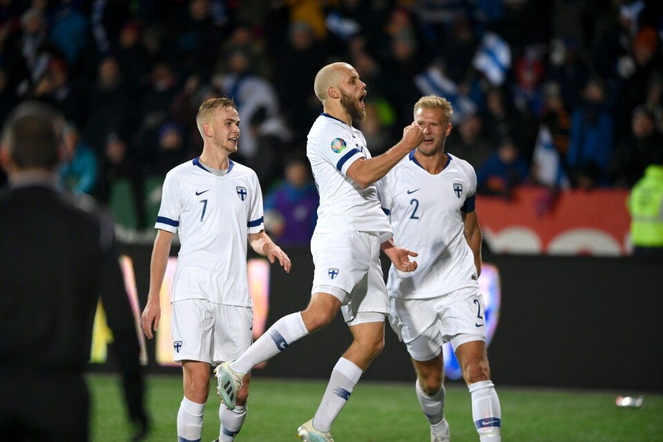 Teemu Pukki of Finland, center, celebrates his goal with teammates Jasse Tuominen, left, and Paulus Arajuuri during the Euro 2020 Group J qualifying soccer match between Finland and Liechtenstein in Helsinki, Finland, on Friday, Nov. 15, 2019.