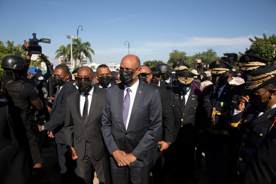 Haitis premiärminister Ariel Henry (mitten) vid ett evenemang i november 2021.