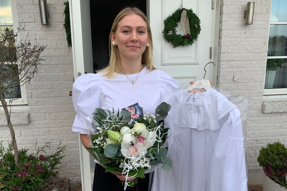 Lucian Emmy Persson, Vinslöv, med blommor och lucialinnet hon ska bära.