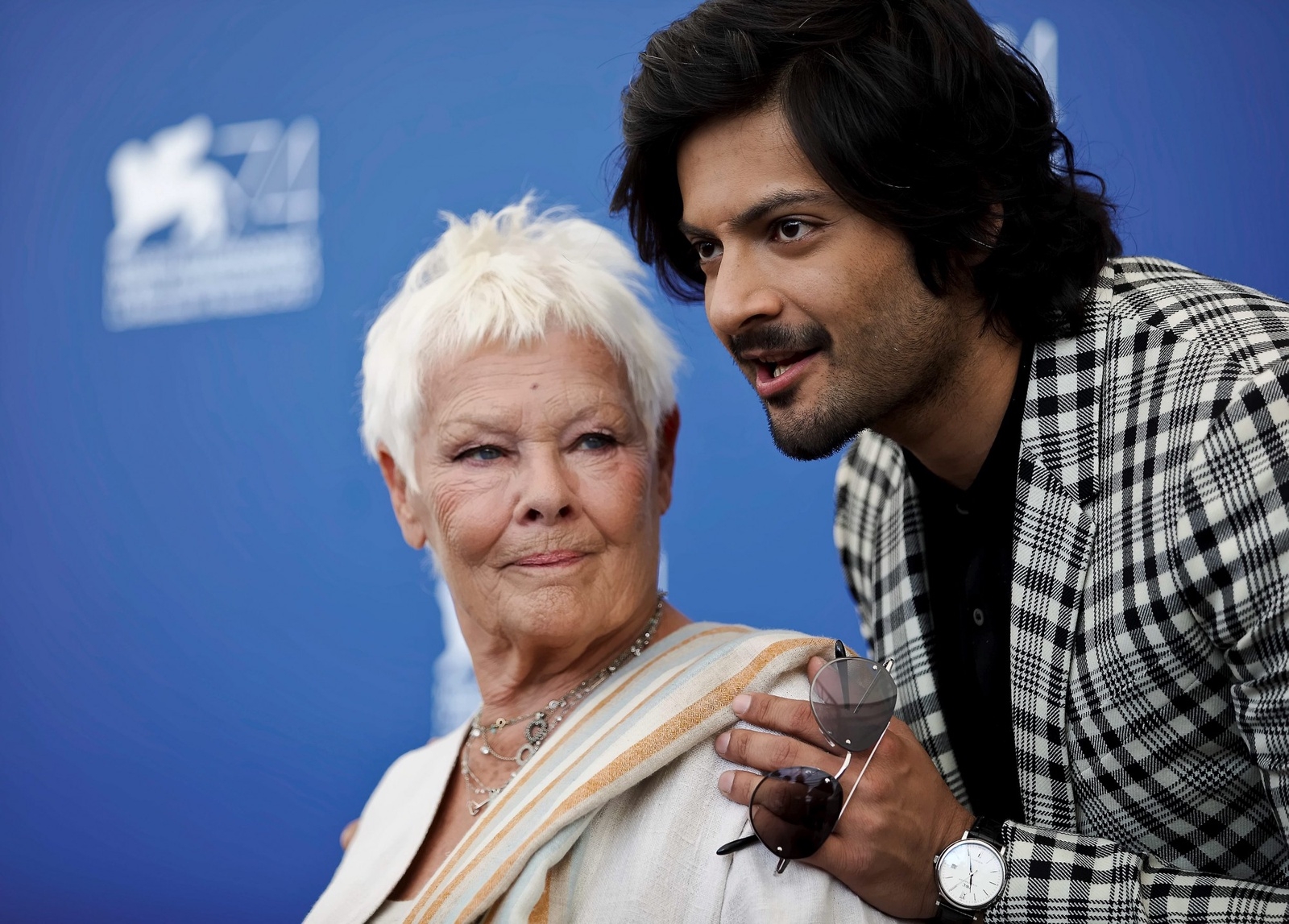 Actors Judi Dench, left, and Ali Fazal pose during a photo call for the film "Victoria And Abdul" at the 74th Venice Film Festival in Venice, Italy, Sunday, Sept. 3, 2017. (AP Photo/Domenico Stinellis)