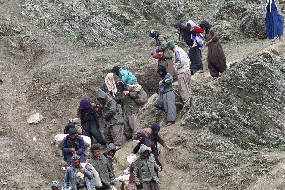 Kurduska flyktingar på flykt i närheten av den iranska staden Sardasht.