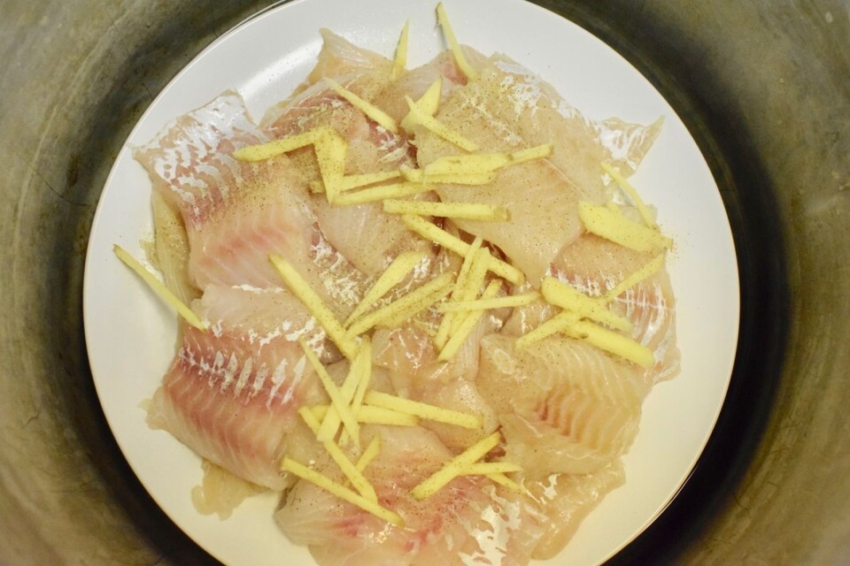 The cod is seasoned with fresh ginger, salt and white pepper before being steamed.